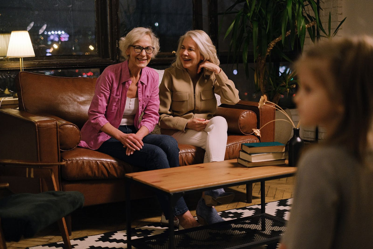 Grandmothers and family sitting together in conversation